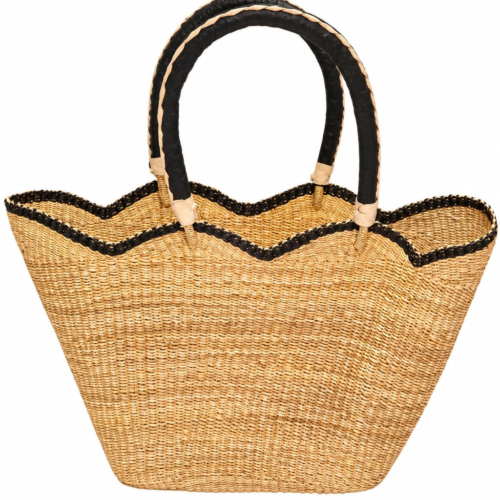 Bolga Dawn large African basket in golden elephant grass with braided handles and wavy rim